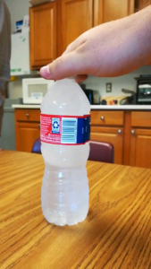Smacking Water Bottle to Freeze It